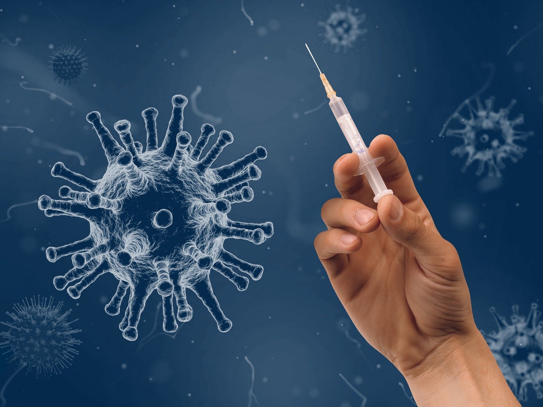 Abbildung des Corona Virus mit Impfspritze
